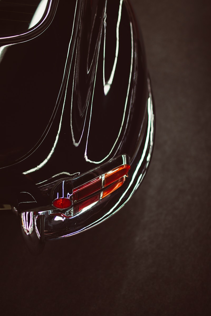 red and black car in close up photography